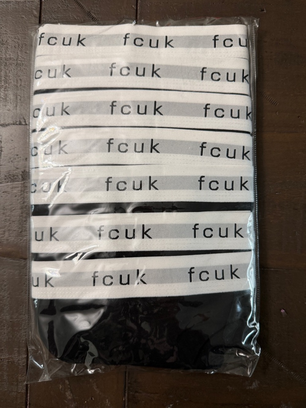 7 pack of French Connection White and Black Striped Logo Waistband Thongs